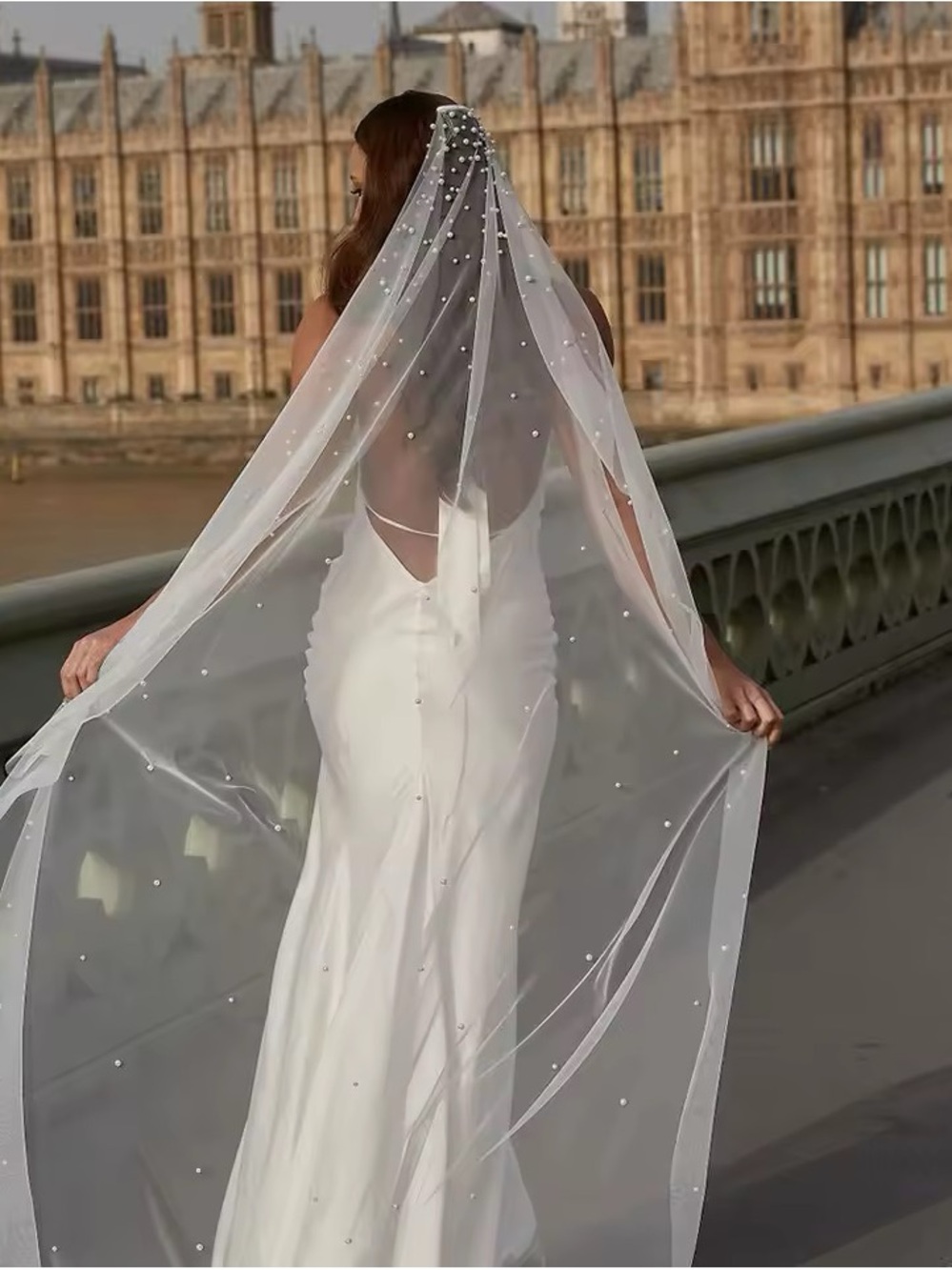 Elegant White Pearl-Embellished Wedding Dress with Long Veil